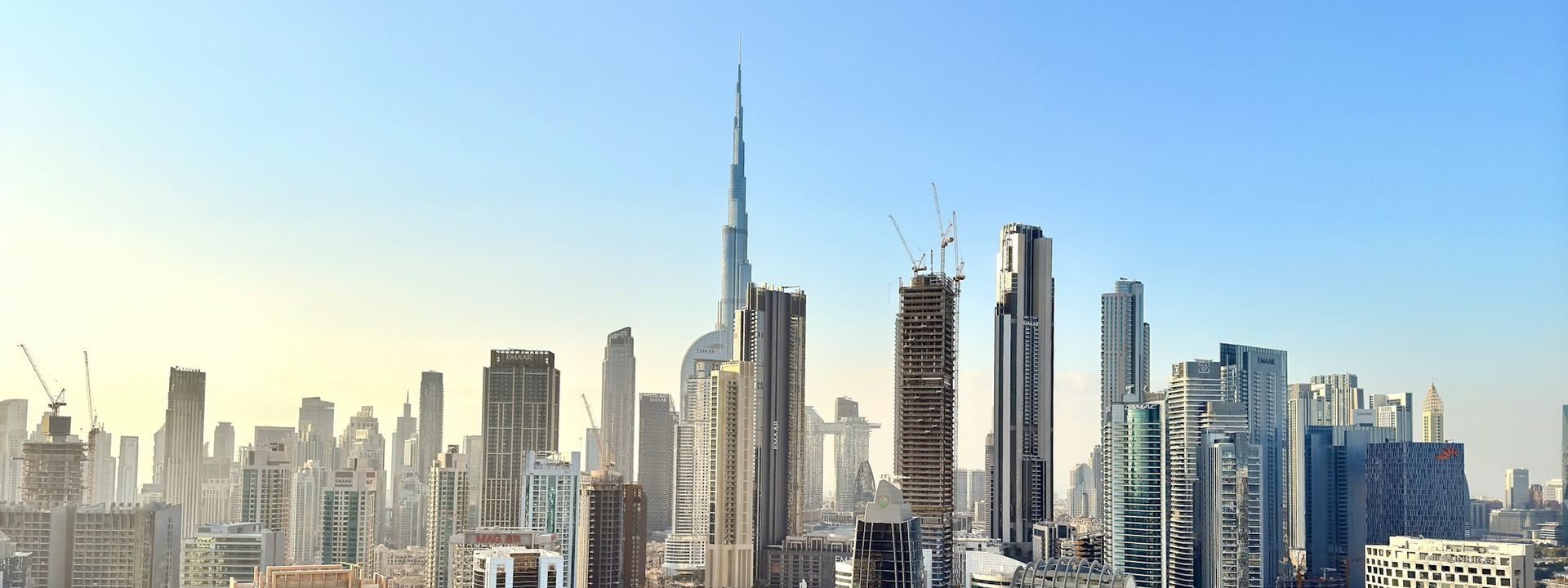Dubai business district on a clear morning, towers along the creek