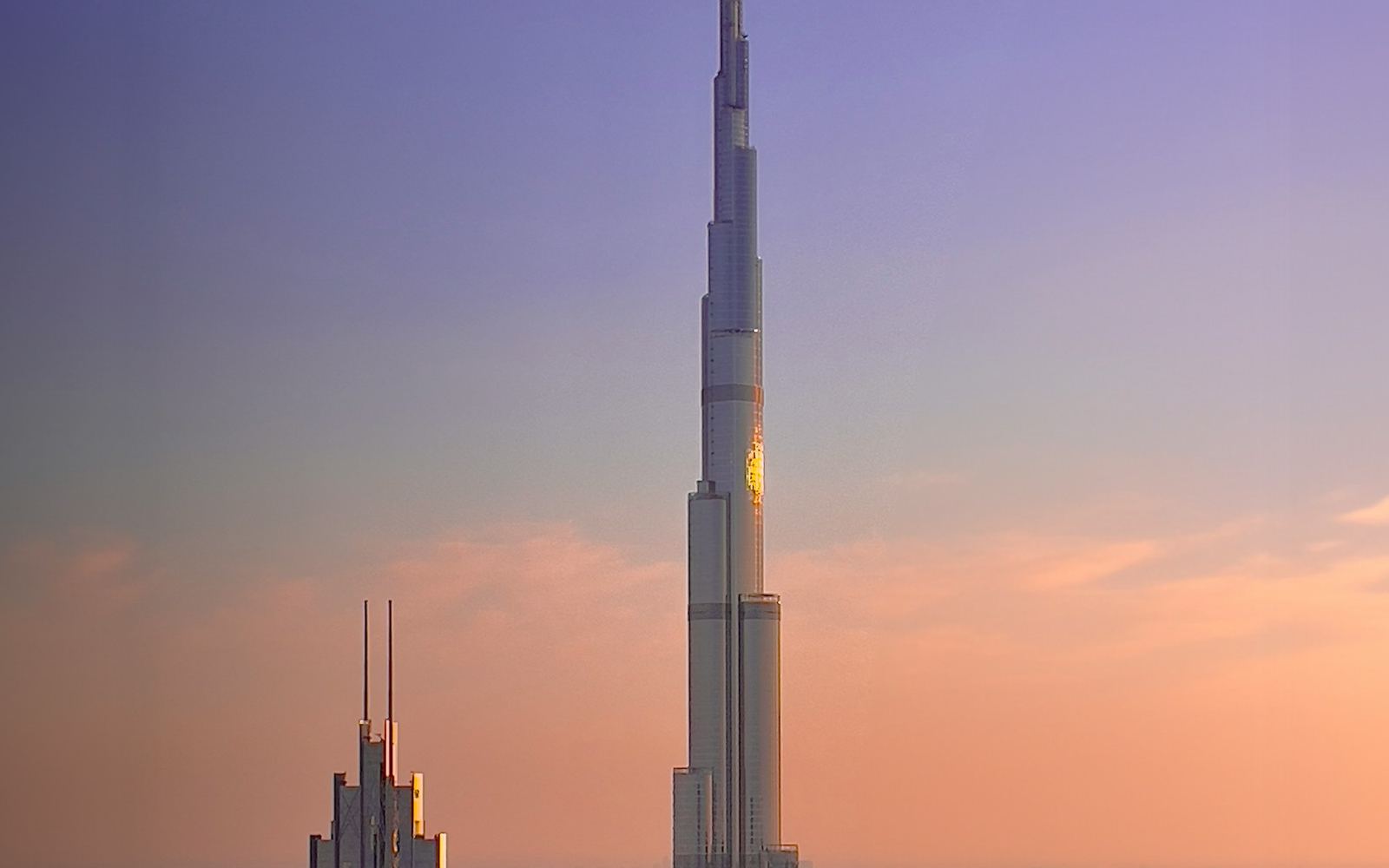 The Burj Khalifa against an amber Dubai sunset