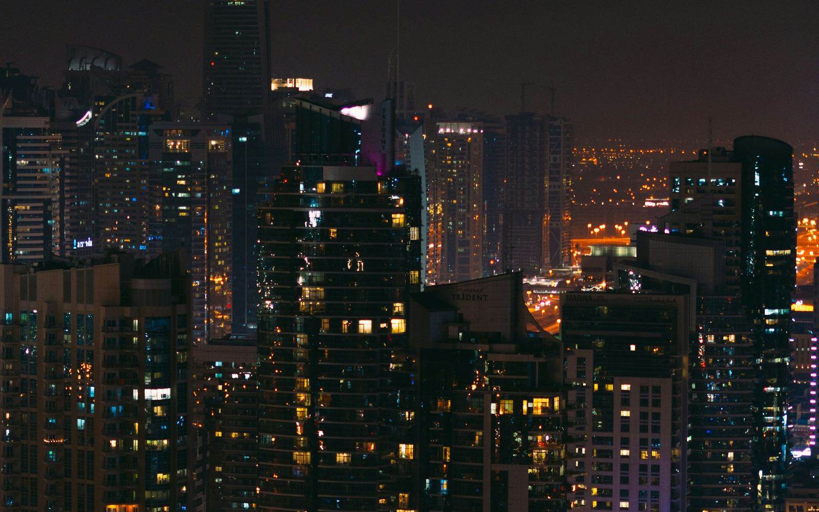 Dubai towers lit up at night